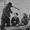 Charles Chaplin, Frank J. Coleman, and Tom Wilson in The Immigrant (1917)