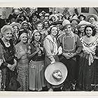 Gene Autry, Ruth Bacon, Smiley Burnette, Fred Burns, Victor Cox, Robert Dudley, Jane Hunt, Jack Kirk, Ula Love, George Montgomery, Polly Rowles, and Rudy Sooter in Springtime in the Rockies (1937)