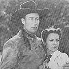 Bill Elliott and Luana Walters in Across the Sierras (1941)