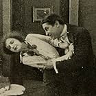 Earl Metcalfe in The Debt (1914)
