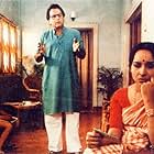 Dipankar Dey, Mamata Shankar, and Bikram Bhattacharya in The Stranger (1991)