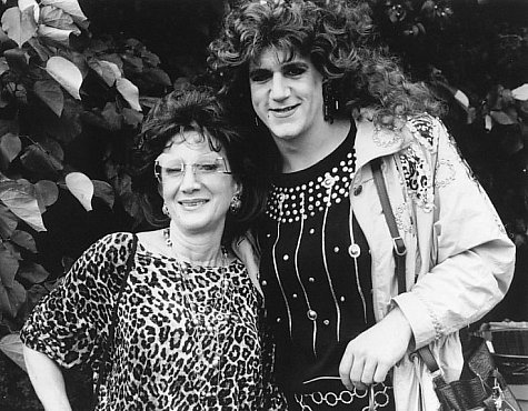 Mrs. Marcangelo (Olympia Dukakis) and her "pre-operative transsexual lesbian" daughter Angelique (Gregory Jbara) celebrate gay pride day.