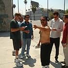 Left to right, Directors Rob Muir and Bob Hilgenberg rehearse actors, Danny Trejo, Johnny Sneed and Christopher Moynihan on the set of "Hiding in Walls".