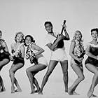 Elvis Presley with Pamela Akert, Darlene Tompkins, Joan Blackman, Jenny Maxwell, and Christian Kay in "Blue Hawaii," Paramount, 1961.