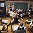 (Center) Jack Black as Dewey, (kids back row, left to right) Robert Tsai as Lawrence, Joey Gaydos Jr. as Zack, Kevin Clark as Freddy and Rebecca Brown as Katie