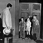 Gregory Peck, Mary Badham, Phillip Alford, and John Megna in To Kill a Mockingbird (1962)