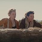 Julia Garner and Jessica Henwick in The Royal Hotel (2023)