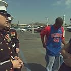 Marine recruiter in Flint, Mich. approaching teenagers outside a shopping mall to enlist them in the military.