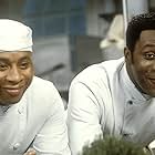 Roger Griffiths and Lenny Henry in Chef! (1993)