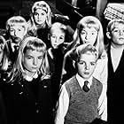 Linda Bateson, June Cowell, Carlo Cura, Howard Knight, Roger Malik, Mark Mileham, Peter Preidel, Lesley Scoble, Teri Scoble, Martin Stephens, Peter Taylor, Elizabeth Munden, and John Kelly in Village of the Damned (1960)