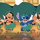 Daveigh Chase, Chris Sanders, and Miranda Paige Walls in Lilo & Stitch (2002)