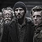 John Hurt, Jamie Bell, and Chris Evans in Snowpiercer (2013)