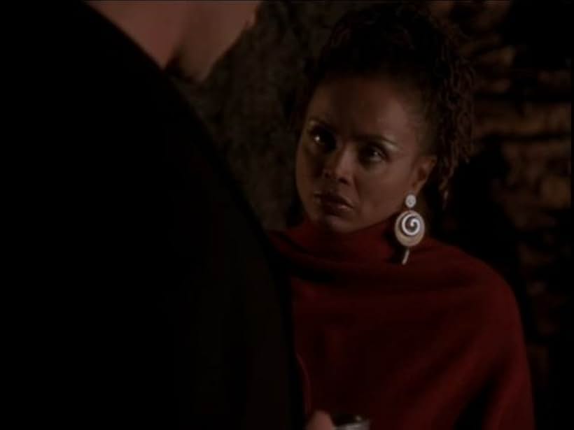 Debbi Morgan and Julian McMahon in Charmed (1998)