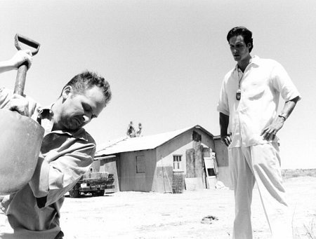 Vance (Dylan Haggerty) furiously digs a grave for Jake as Terry (Randall Batinkoff) looks on.