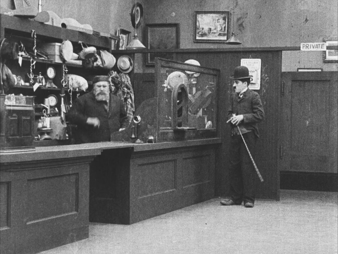 Charles Chaplin and Henry Bergman in The Pawnshop (1916)