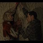 Burn Gorman and Maika Monroe in Watcher (2022)