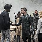 John Barrowman, Manu Bennett, Katrina Law, Stephen Amell, Anna Hopkins, Echo Kellum, and Emily Bett Rickards in Arrow (2012)