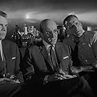 Peter Sellers, George C. Scott, and Jack Creley in Dr. Strangelove or: How I Learned to Stop Worrying and Love the Bomb (1964)