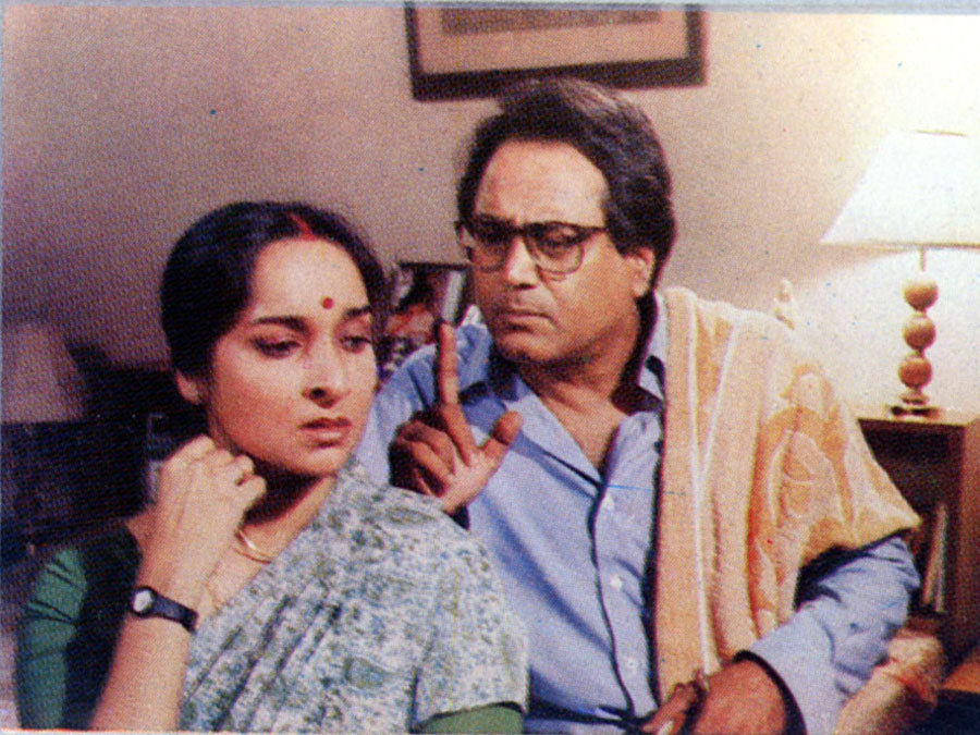 Dipankar Dey and Mamata Shankar in The Stranger (1991)