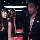 Kathy Uyen and Derek Ting in Supercapitalist (2012)