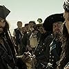 Johnny Depp, Geoffrey Rush, Lee Arenberg, David Bailie, Orlando Bloom, Christopher S. Capp, Mackenzie Crook, Martin Klebba, Keira Knightley, Reggie Lee, Kevin McNally, and Salsa in Pirates of the Caribbean: At World's End (2007)