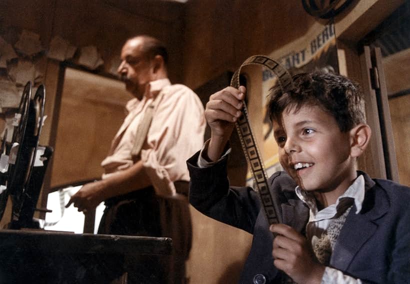 Salvatore Cascio and Philippe Noiret in Cinema Paradiso (1988)