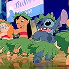 Daveigh Chase, Chris Sanders, and Miranda Paige Walls in Lilo & Stitch (2002)