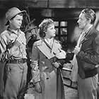 Stuart Crawford, Laraine Day, and Barry Nelson in A Yank on the Burma Road (1942)