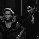 Steve Cochran and Virginia Mayo in White Heat (1949)