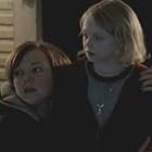 Emily Bergl and Dakota Fanning in Taken (2002)