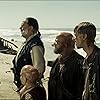 Johnny Depp, Lee Arenberg, David Bailie, Christopher S. Capp, Mackenzie Crook, Martin Klebba, Kevin McNally, and Salsa in Pirates of the Caribbean: At World's End (2007)