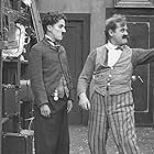 Charles Chaplin and John Rand in The Pawnshop (1916)