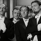 Alec Guinness, Peter Copley, and Andrew Faulds in The Promoter (1952)