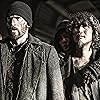 Jamie Bell, Chris Evans, Song Kang-ho, and Ko Ah-sung in Snowpiercer (2013)