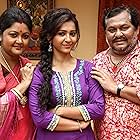 Kharaj Mukherjee and Koushani Mukherjee in Parbona Ami Chartey Tokey (2015)