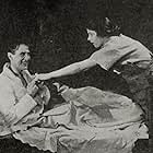 Taylor Holmes and Virginia Valli in Uneasy Money (1918)