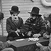 Charles Chaplin, Frank J. Coleman, and Tom Wilson in The Immigrant (1917)