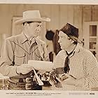 Smiley Burnette and Charles Starrett in The Blazing Trail (1949)