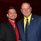 Louisiana State Fire Marshal H. "Butch" Browning presents UPSTAIRS INFERNO director Robert L. Camina with an honorary medallion for his work and dedication to the Up Stairs Lounge fire story. [June 24, 2015]