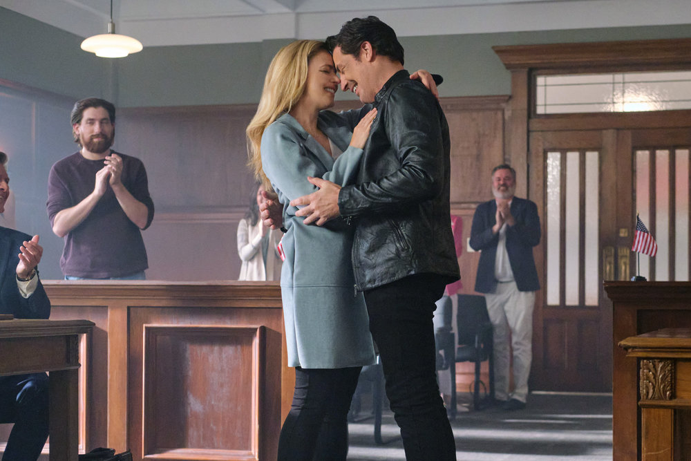 Brennan Elliott and Amanda Schull in Marry Go Round (2022)