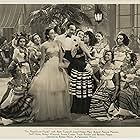 Virginia Dabney, Paula DeCardo, Steffi Duna, Patricia Morison, Lloyd Nolan, Barbara Pepper, and Luana Walters in The Magnificent Fraud (1939)