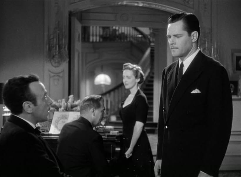 Bette Davis, George Coulouris, Paul Lukas, and Donald Woods in Watch on the Rhine (1943)