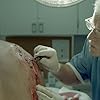 ER Doctor (Christopher Toyne) removes gravel from Johnny (Jared Miller) as yet again his Hog gives him a spill.