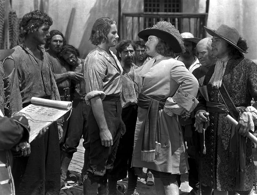 Errol Flynn, Lionel Atwill, Guy Kibbee, and J. Carrol Naish in Captain Blood (1935)