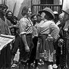 Errol Flynn, Lionel Atwill, Guy Kibbee, and J. Carrol Naish in Captain Blood (1935)