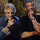 John Herzfeld and Sylvester Stallone on set of Escape Plan, The Exstractors 2017s