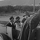 Charles Chaplin, Jackie Coogan, Marion Feducha, and Edna Purviance in A Day's Pleasure (1919)