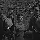 Lon Chaney Jr., James Craig, Tom Drake, and Gloria Talbott in The Cyclops (1957)