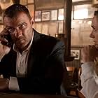 Liev Schreiber and Kerry Condon in The Transfer Agent (2019)