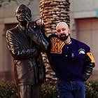 Waukegan News-Sun: Two Favorite Sons    Bryan W. Simon wears his local colors proudly while posing alongside a statue of another Waukegan born and bred artist Jack Benny.